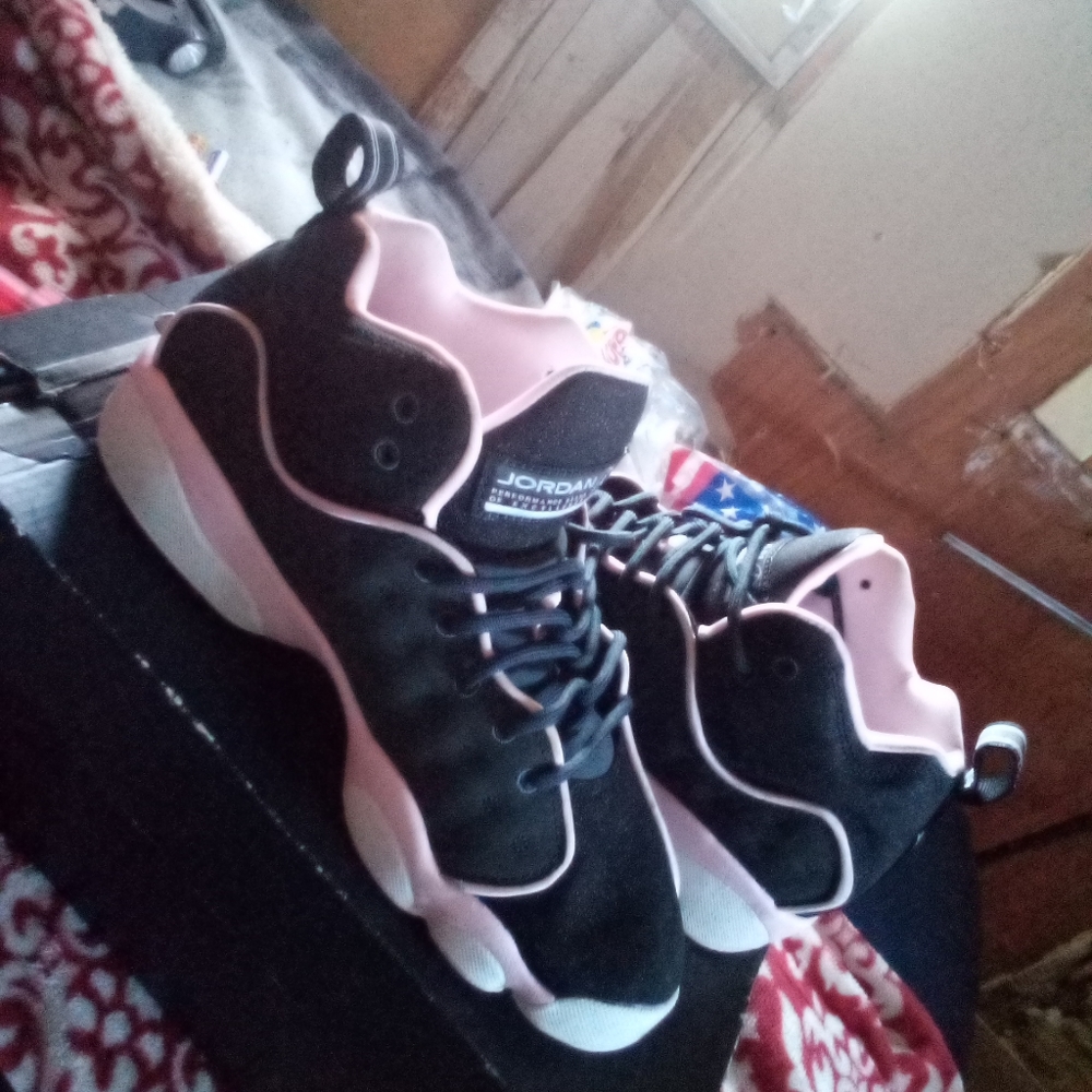 Pink female Jordans grey black 7